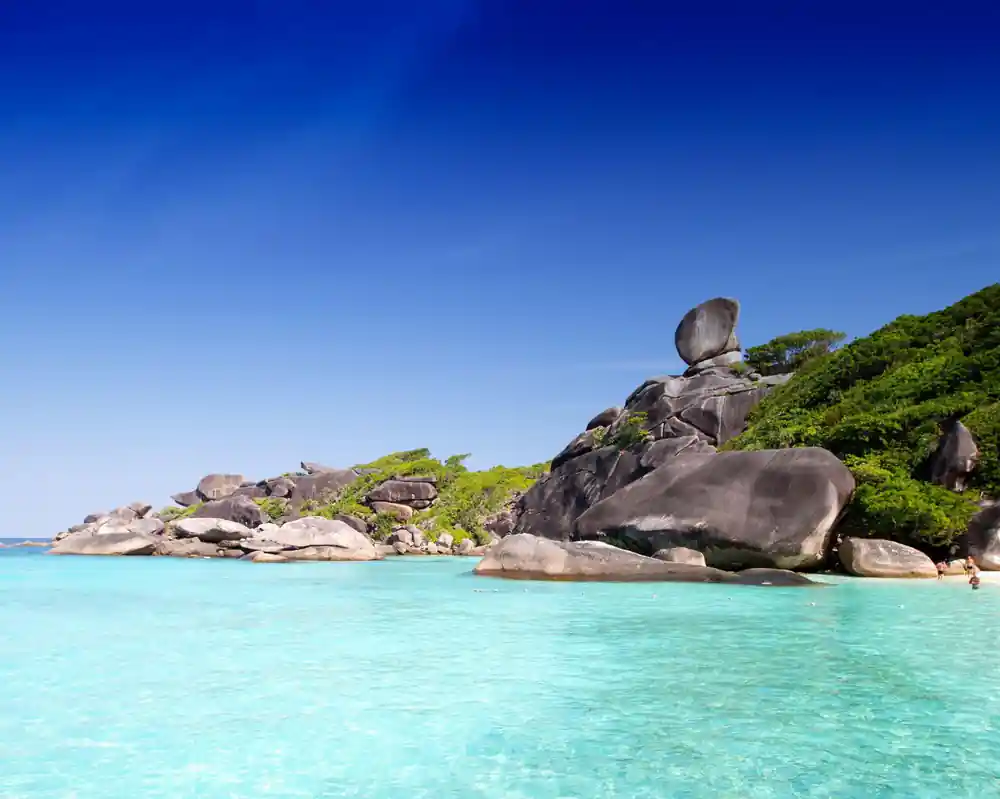 Massive granite boulder formations on tropical beach