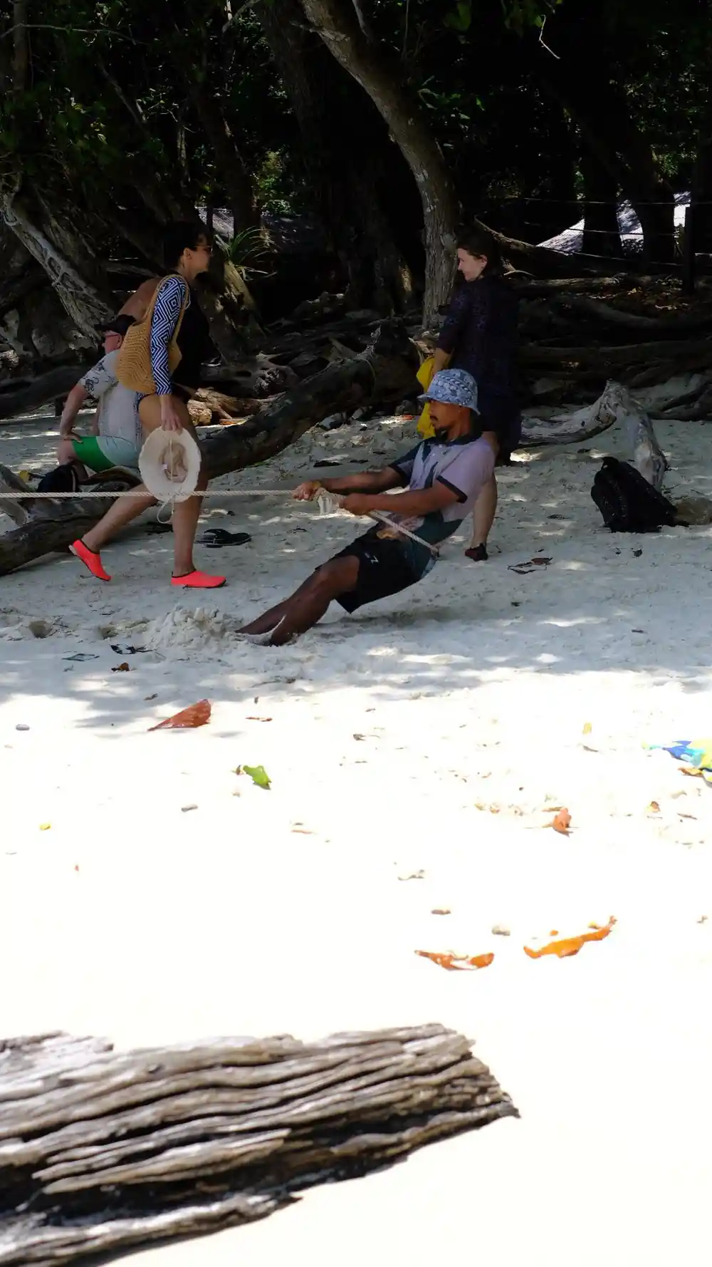 Two people playing beach games on sandy shore